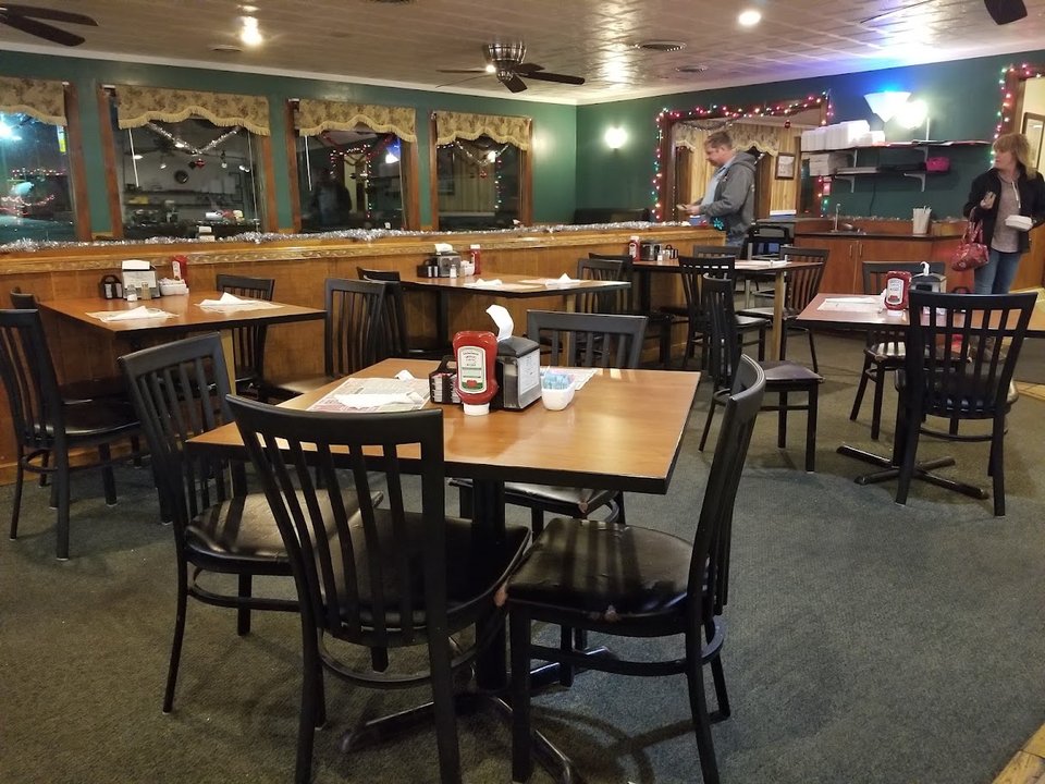 Bright counter seating inside a casual restaurant.