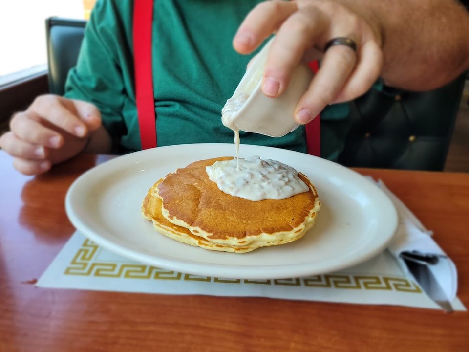 Pancakes with a Cup of Sausage Gravy